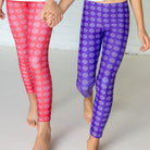 Bellybunny-Youth Leggings-purple with white sun pattern and red with white sun pattern