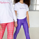 Bellybunny-Youth Leggings-purple with white sun pattern and red with white sun pattern